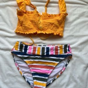 Yellow swim top size L, rainbow bottoms S, scrunch top, ruffle sleeve/tie back